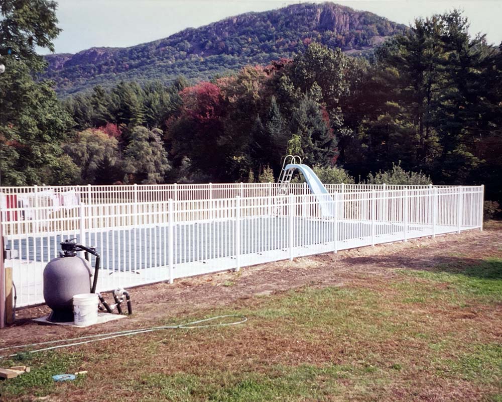 A custom white metal fence near Easthampton, MA